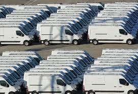 Rows of white cargo vans ready for deployment